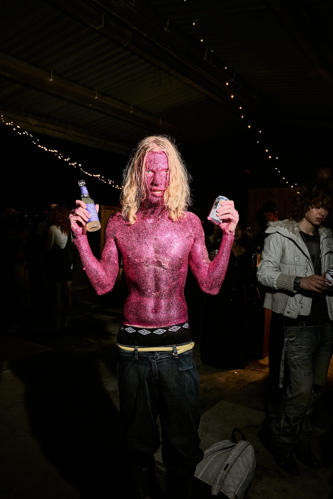 A model in pink body paint at GLISTER